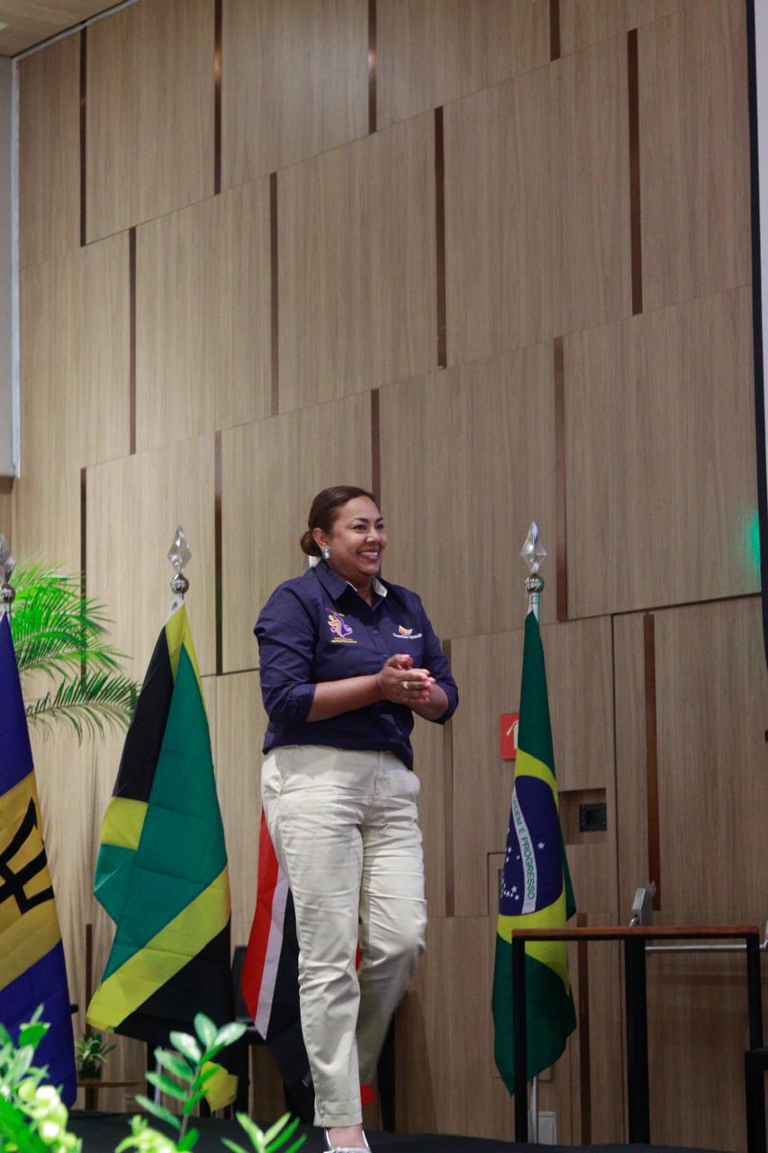 Lady Life Insurance lead advisor smiling while speaking on stage at a professional event